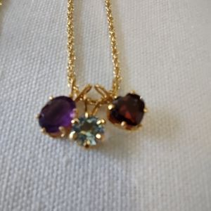 Amethyst, aquamarine and heart shaped garnet on gold-tone chain